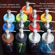 13 colors and styles of Mason jar soap pump adapter lids with stainless steel pumps on Ball jars