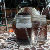2 Quart jars with water and stainless steel straws