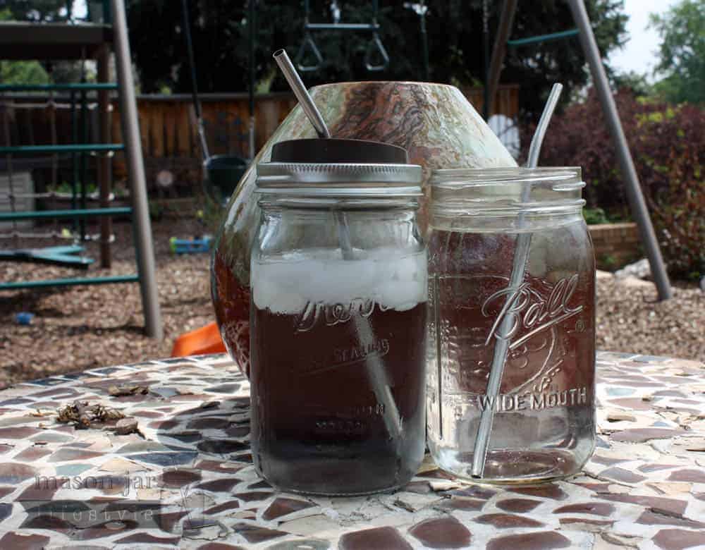 2 Quart jars with water and stainless steel straws