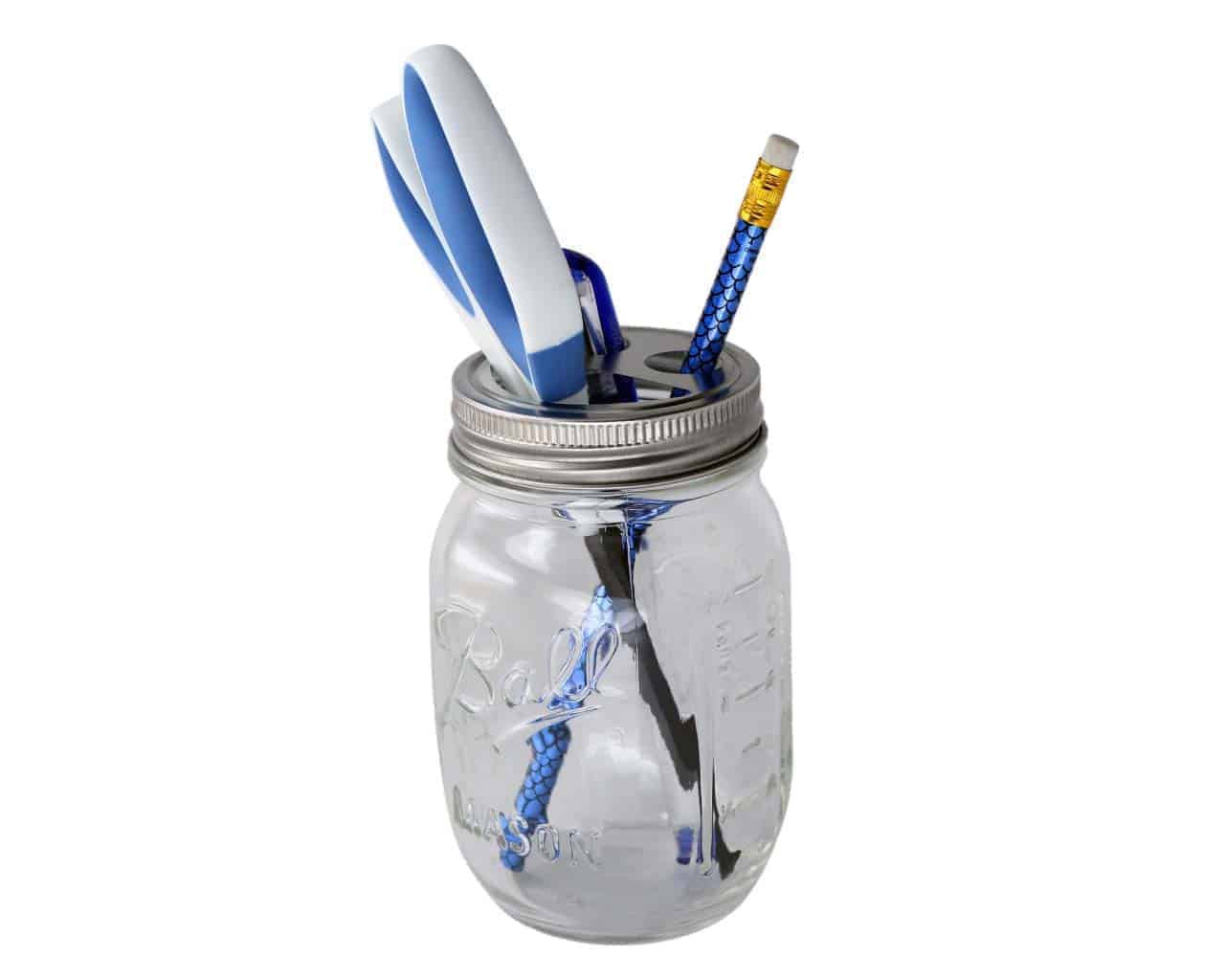 Toothbrush holder lid on regular mouth Ball pint jar with pen, pencil, and scissors
