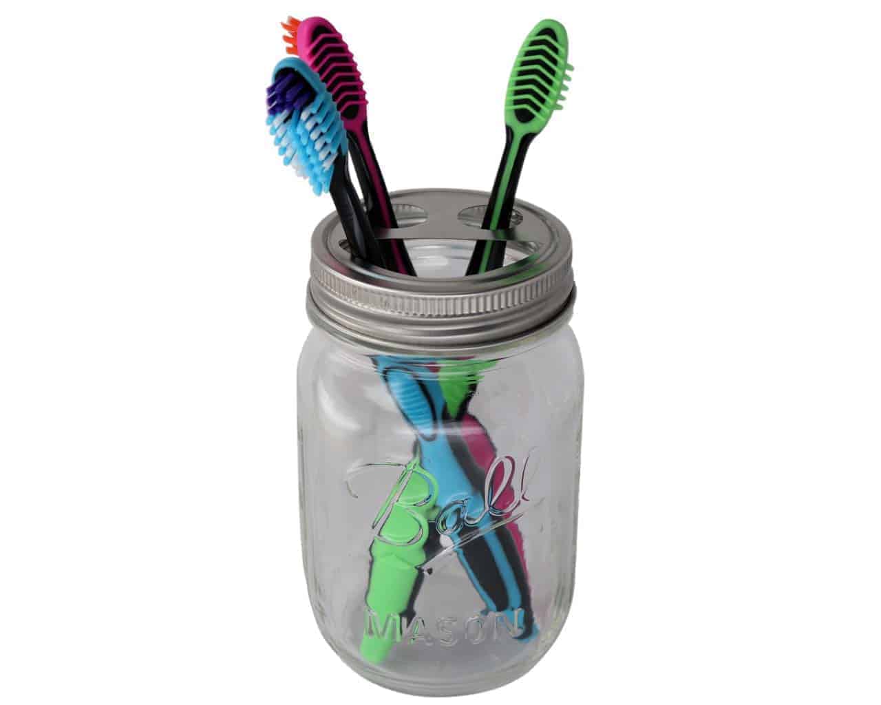 Toothbrush holder lid on regular mouth Ball pint jar with toothbrushes