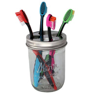 Toothbrush holder lid on wide mouth Kerr pint jar with toothbrushes