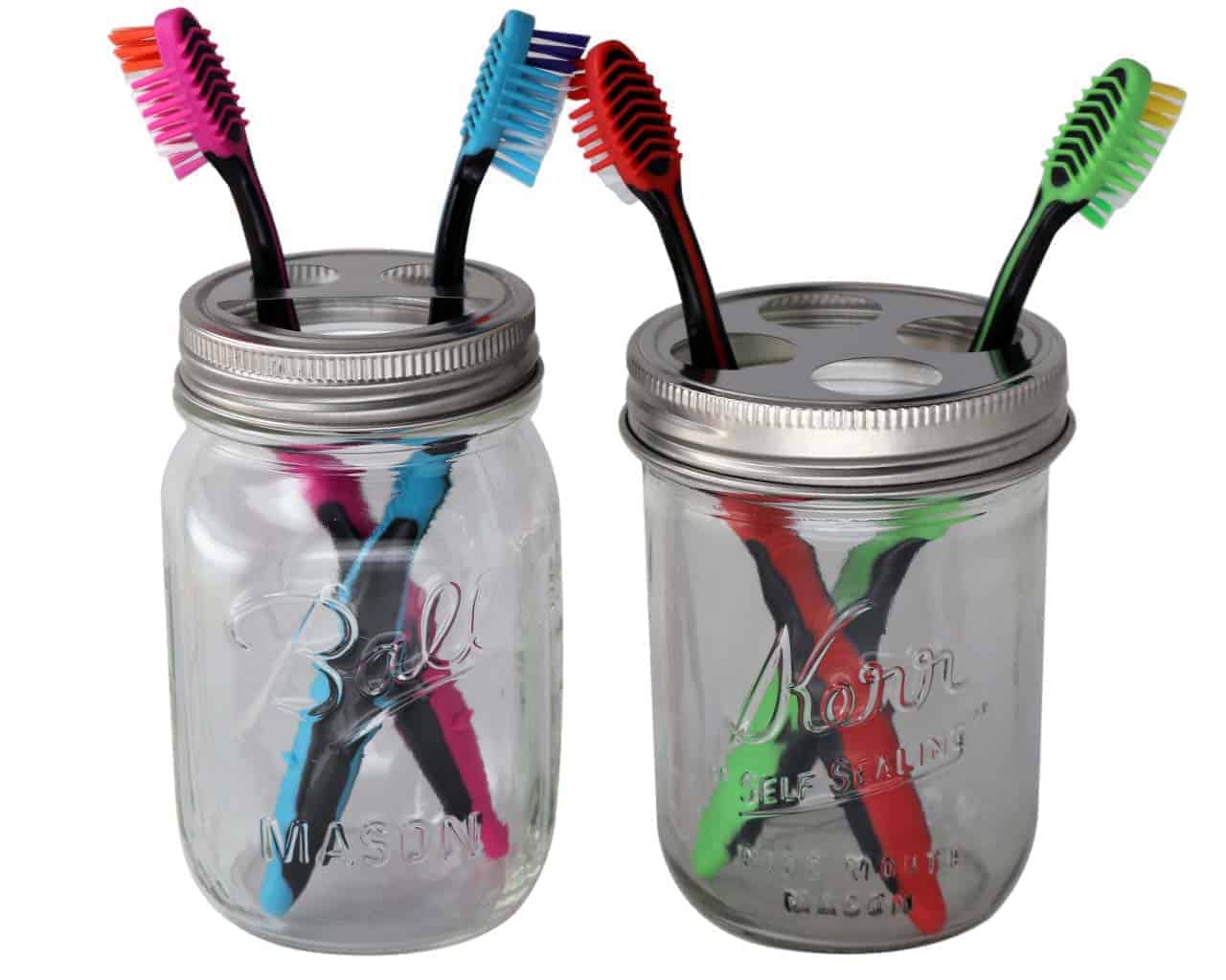 Toothbrush holder lids on wide mouth Kerr pint jar and regular mouth Ball pint jar with toothbrushes