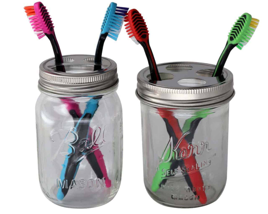 Toothbrush holder lids on wide mouth Kerr pint jar and regular mouth Ball pint jar with toothbrushes