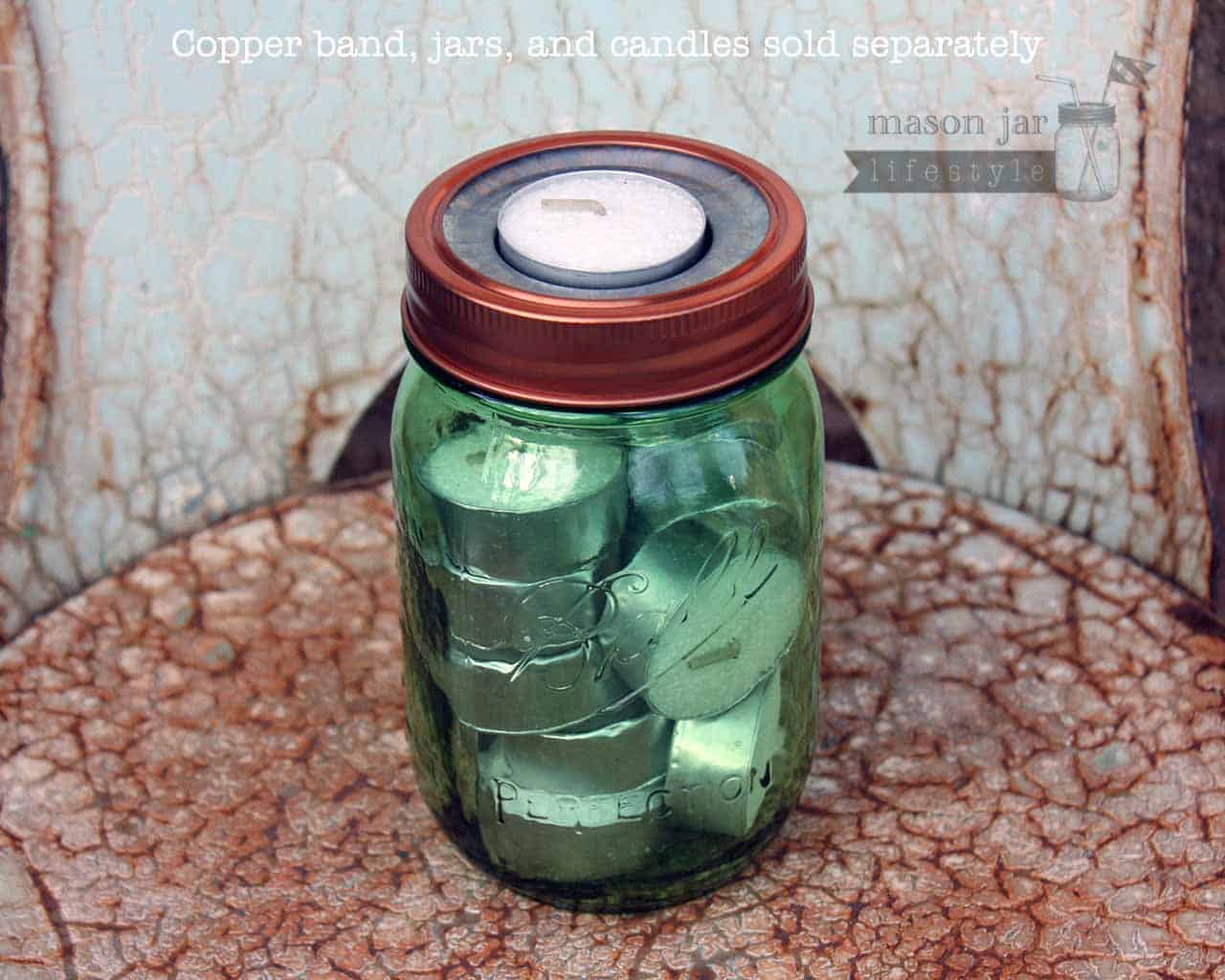 Metal tea light candle holder insert with copper band on green Ball jar with extra tea lights