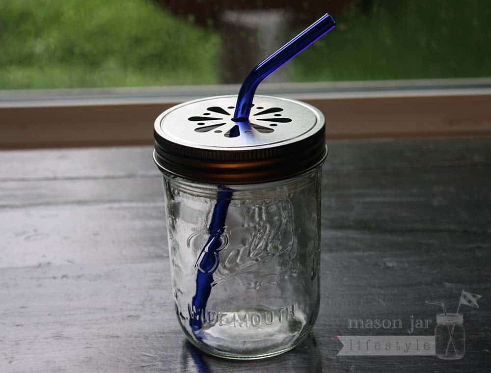 Wide mouth pint Ball jar with daisy lid and blue glass bent straw