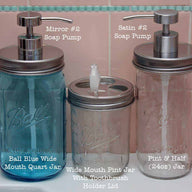 Stainless steel wide mouth soap lids and toothbrush lid on 3 sizes of Ball Mason jars